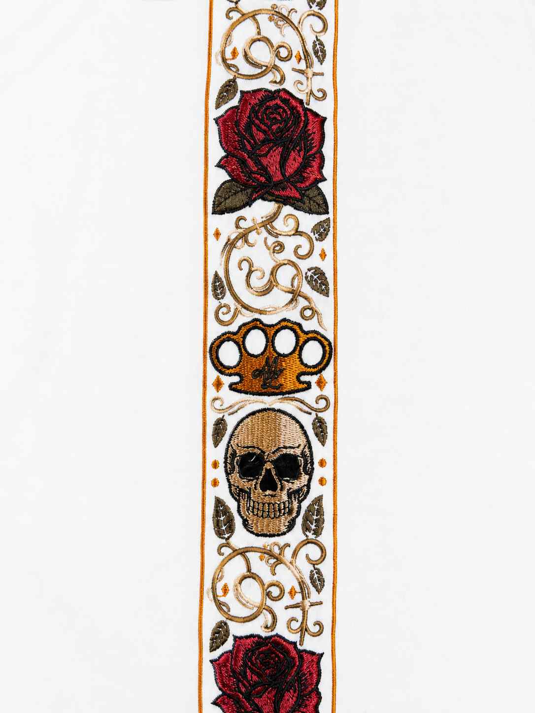 Close-up of the Calavera band with roses, skull and gold MVL logo on white