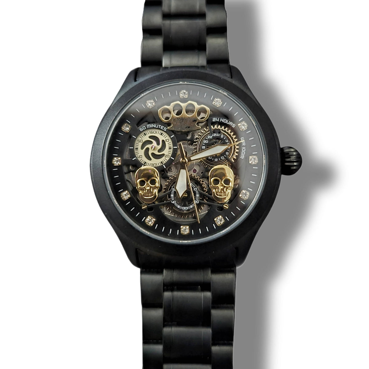 Fronte dell'orologio Double skull nero opaco con due teschi dorati e movimento a vista