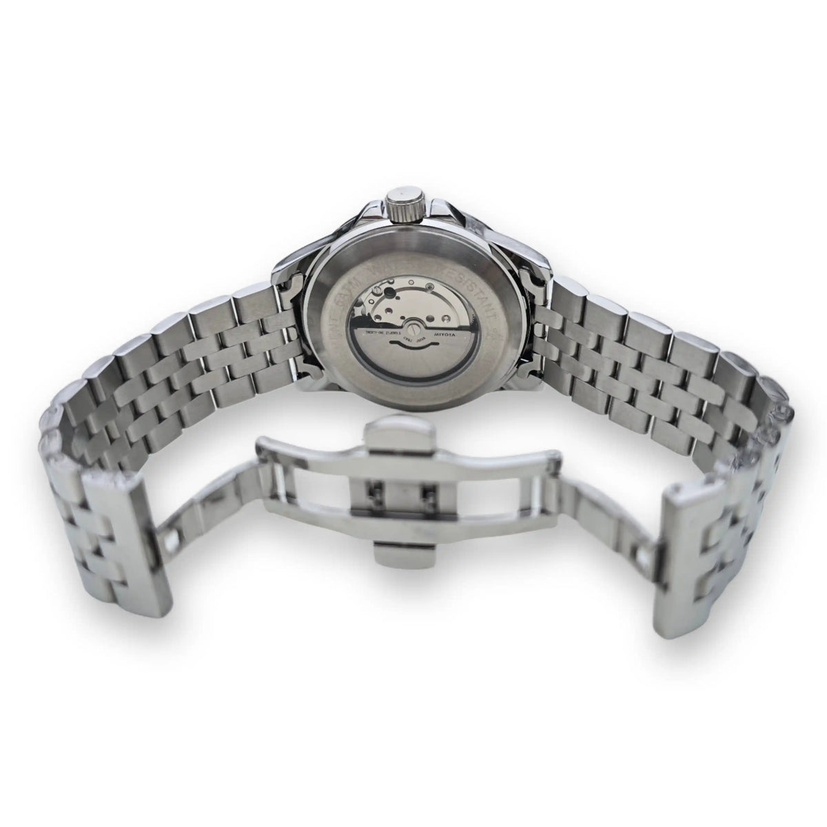 Dos de la montre MVL AK47 argentée avec mouvement automatique visible et boucle déployante