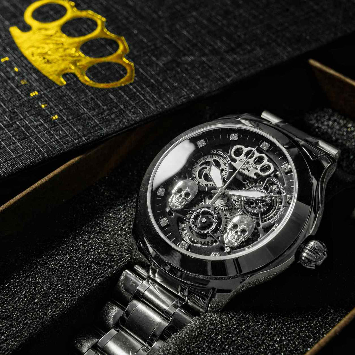 Reloj de pulsera automático Mi Vida Loca Double skull plateado en la caja, esfera esqueleto con dos calaveras